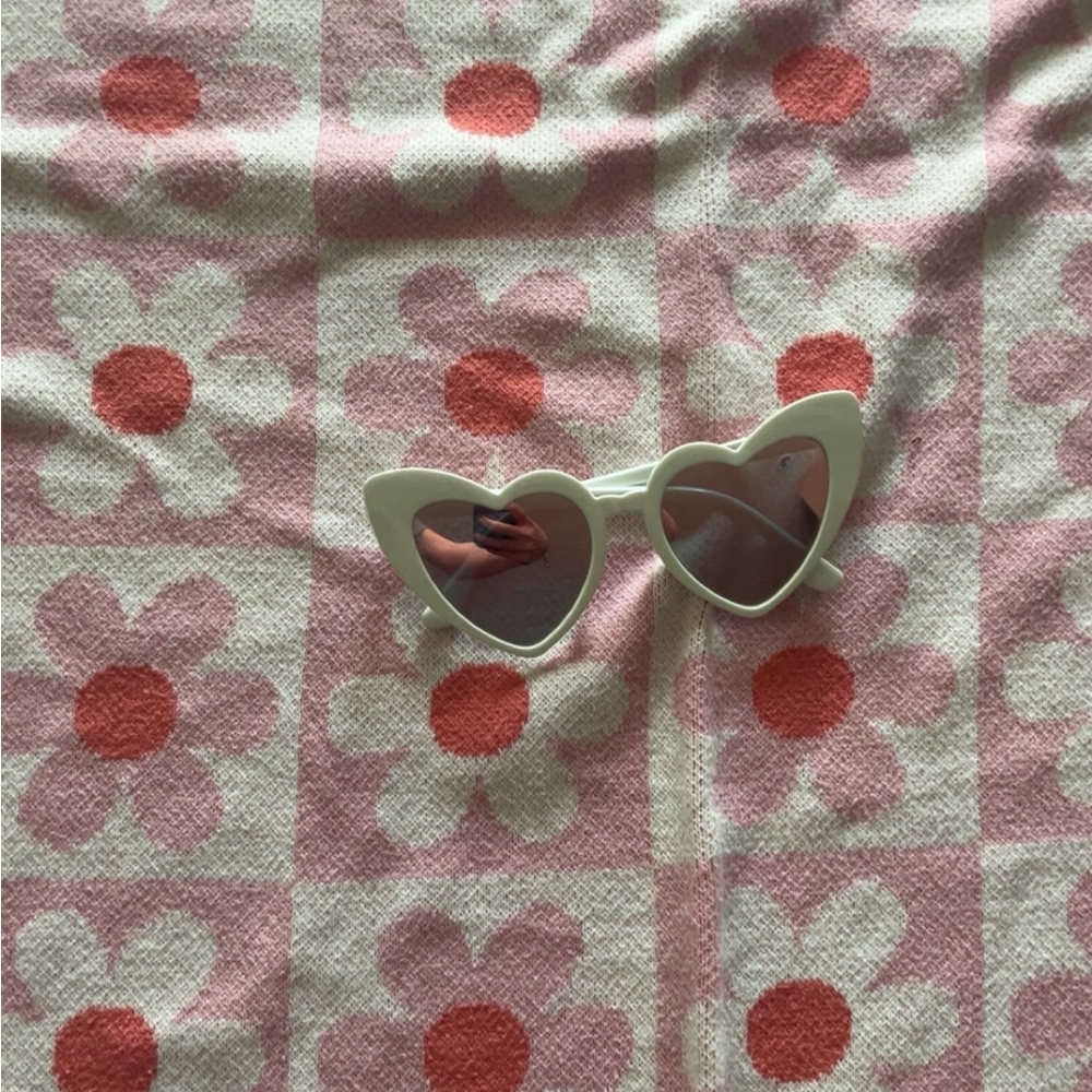 Target Heart-Shaped Sunglasses with Pink Floral Background
